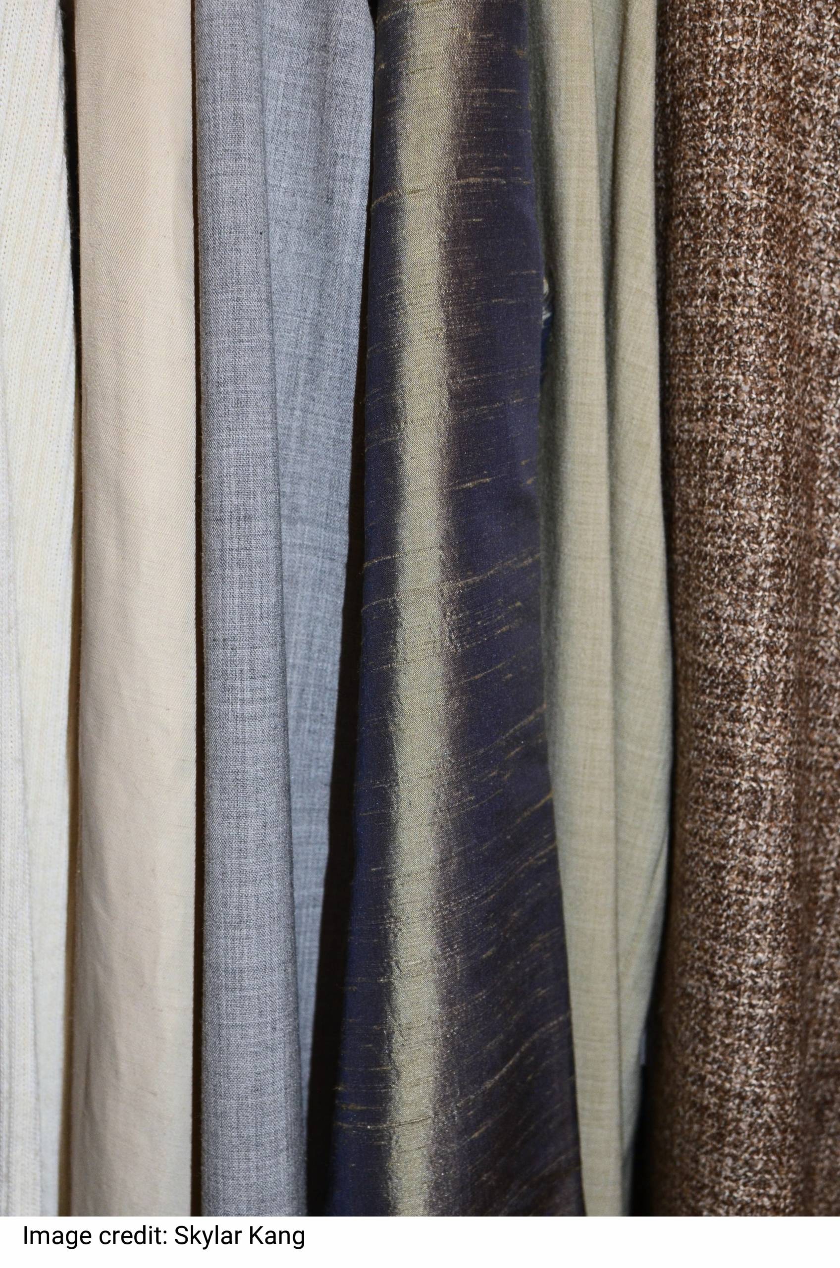 Collection of clothes in wardrobe by Skylar Kang Collection of clothes in wardrobe